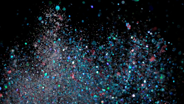 Realistic Glitter Exploding on Black Background. - Photo, Image