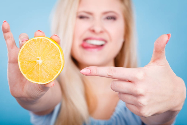 Woman holding fruit lemon or orange - Photo, Image