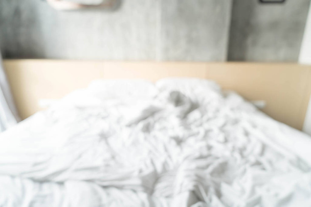 abstract blur rumpled bed with white messy pillow - Foto, Imagen