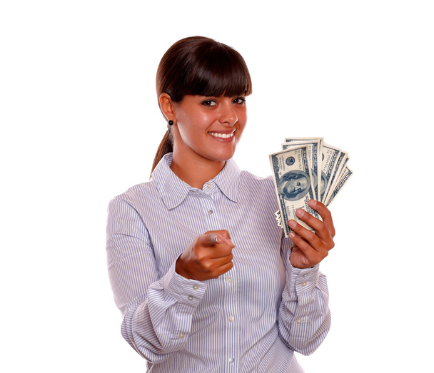 Young woman pointing at you and holding dollars - Photo, Image