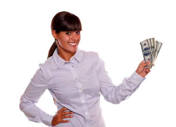 Smiling young woman holding cash money - 写真・画像