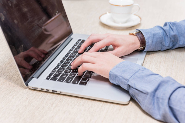 close up hand of businessman use keyboard on laptop. - Фото, зображення