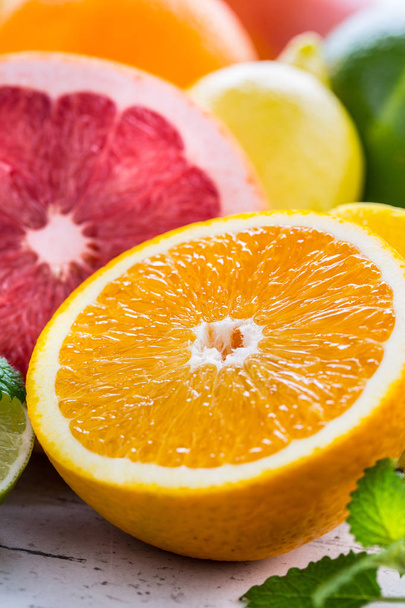 Citrus fresh fruit. Orange grapefruit lemon lime with mint leaves - Fotó, kép