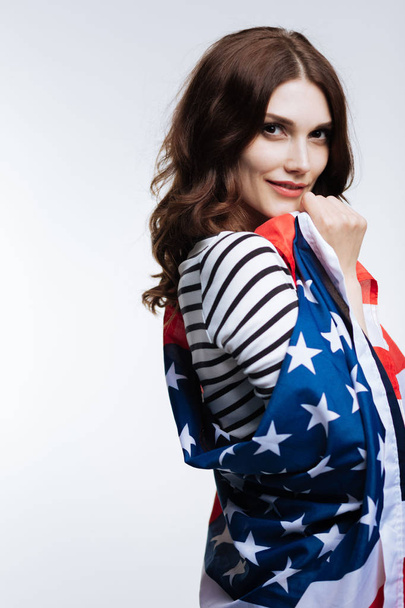 Gorgeous young woman posing with American flag - Фото, зображення