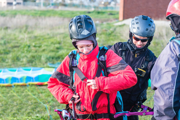 Preparation of tandem paraglider for the first flight - Photo, image