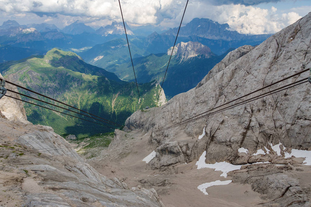 Cable car cables and wheels against vertical rock - Photo, Image