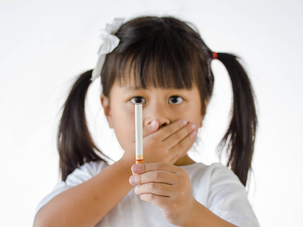 Cigarette in hand little Girl, cigarette focus - Foto, Imagem