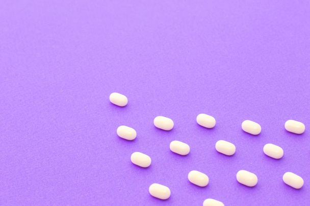 tic tac sweets on violet background - Foto, afbeelding