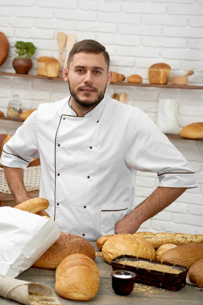 Young man working at his bakery - Photo, Image