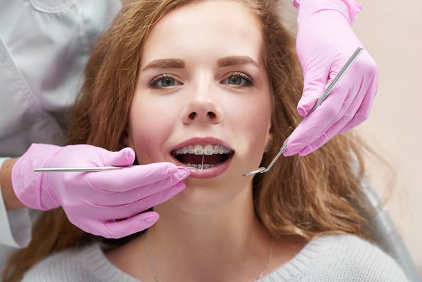 Young woman at the dentist office - Фото, изображение