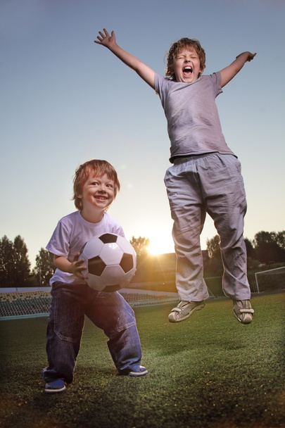 Two happy boy play in soccer - Photo, image