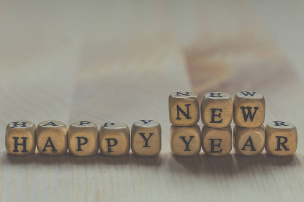 Happy New Year - words from letters on wooden cubes - Fotó, kép