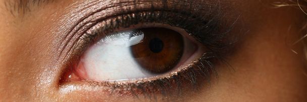 Eye of a black woman shot large macro beauty - Photo, image
