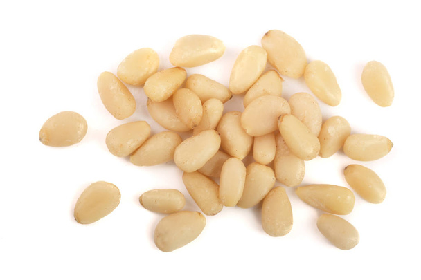 Shelled cedar pine nuts isolated on white background. top view - Фото, изображение