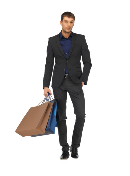 handsome man in suit with shopping bags - Foto, immagini