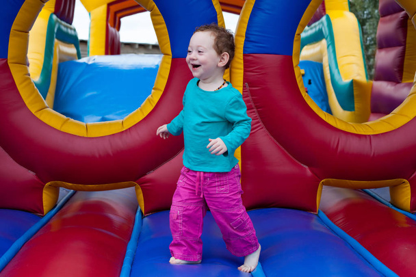 Funny toddler run on trampoline - Photo, Image