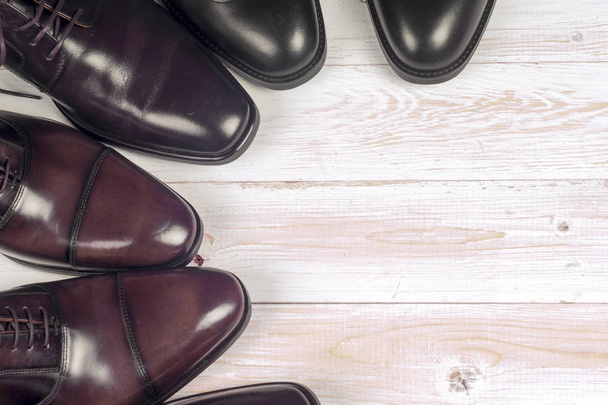 Male fashion with shoes on wooden background. - 写真・画像