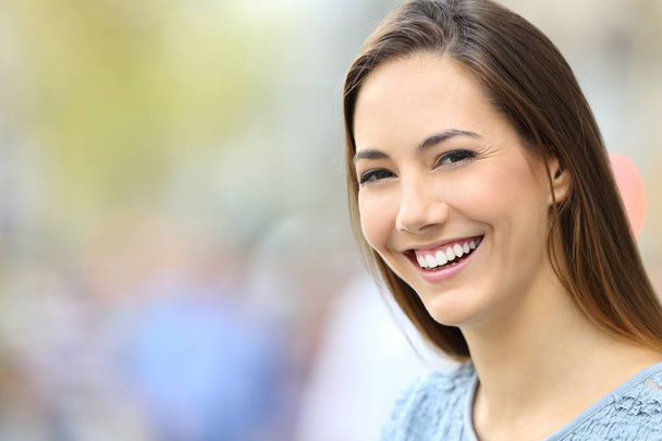 Woman with perfect smile and white teeth looking at you - Photo, image