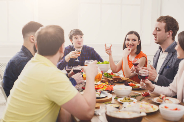 Group of happy people at festive table dinner party - Photo, Image