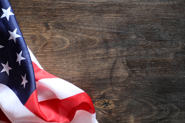 American flag on a wooden texture table - Фото, зображення