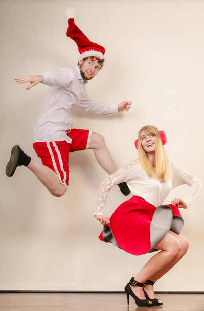 Happy active couple dancing and jumping. - Фото, изображение