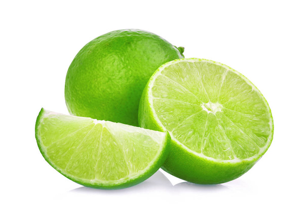 whole and half with slice of fresh green lime isolated on white  - Foto, Imagem