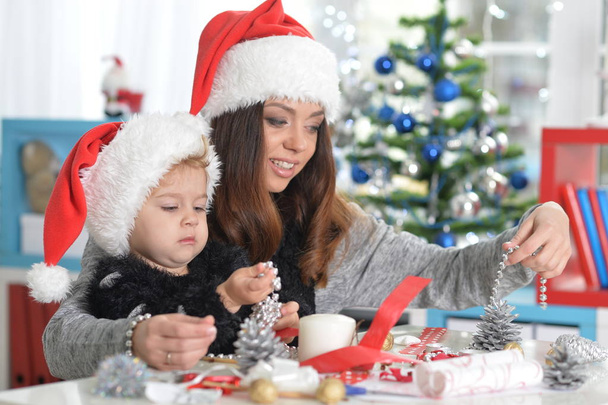 Mother and daughter preparing for Christmas - Фото, изображение