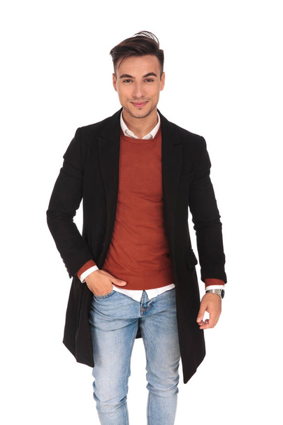 happy young business man standing with hand in pocket  - Foto, Bild