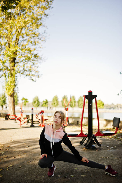 Young girl has the training and doing exercise outdoors on stree - Foto, immagini