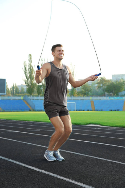 Young man jumping rope - Fotografie, Obrázek