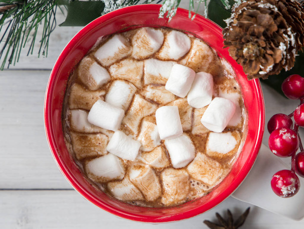 Christmas hot chocolate with marshmellow on light wooden background - 写真・画像