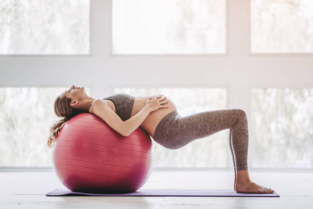 Pregnant woman workout - Photo, Image