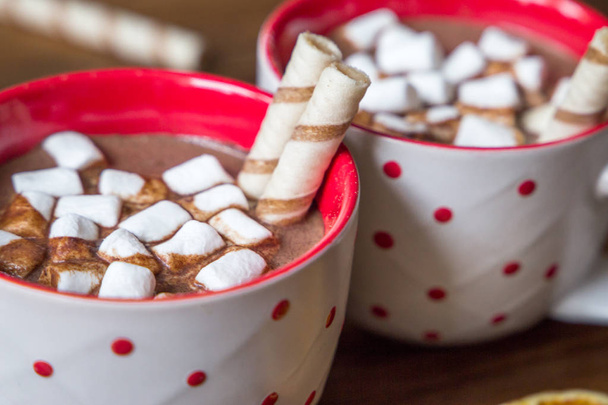 Hot chocolate with marshmallows isolated on wooden background. - Фото, зображення