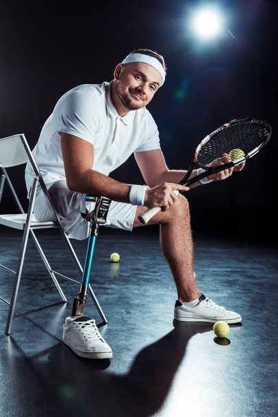 paralympic tennis player resting on chair - Fotoğraf, Görsel