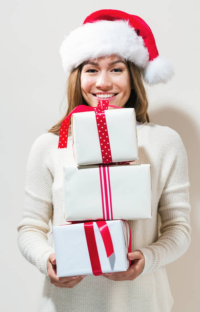 Woman holding Christmas gifts - Foto, Imagem