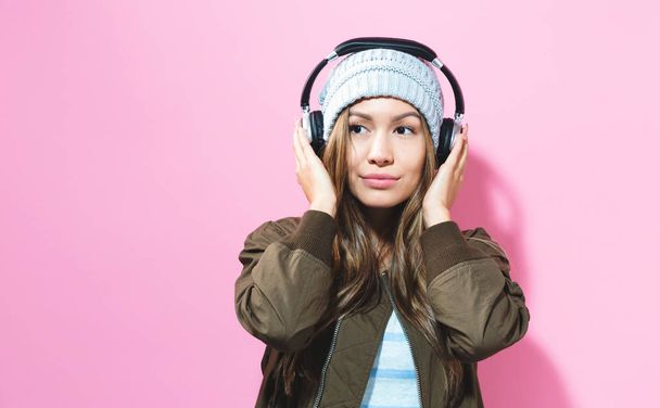 Young woman with headphones - Fotó, kép