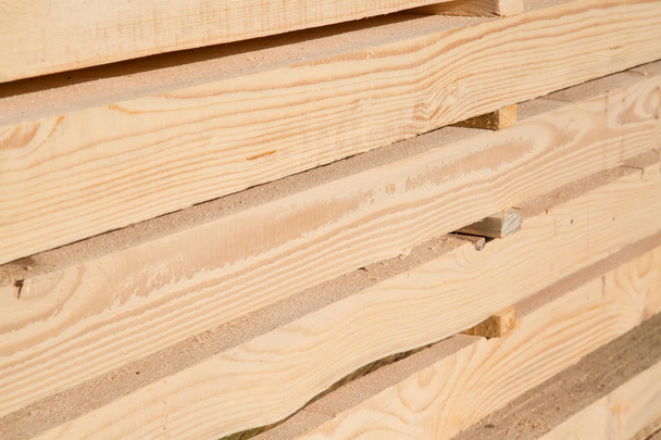 Stack of new wooden studs - Фото, изображение