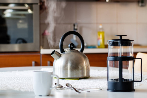 Morning yerba tea. Tasty tea brewed in cafetiere on the kitchen  - Фото, зображення