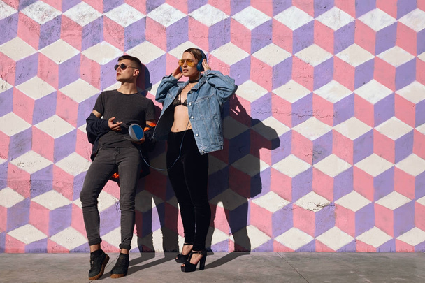 Trendy hipster couple posing on street - Фото, изображение