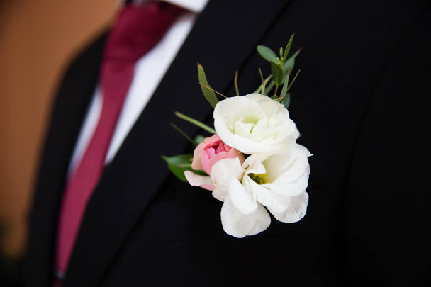Wedding boutonniere on suit of groom - 写真・画像