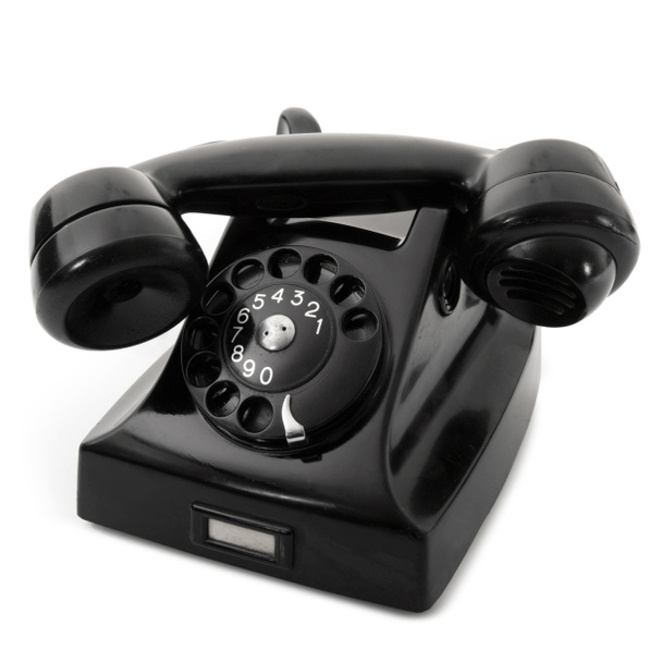 teléfono obsoleto sobre fondo negro
 - Foto, Imagen