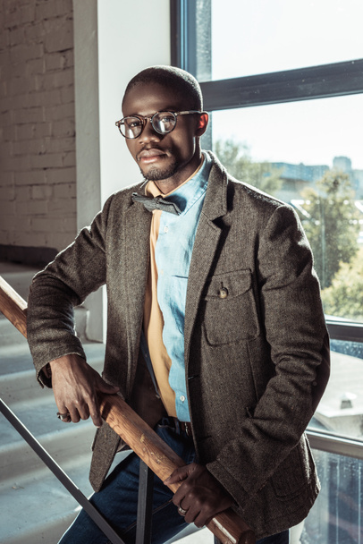 Stylish african american man on stairs - Photo, Image