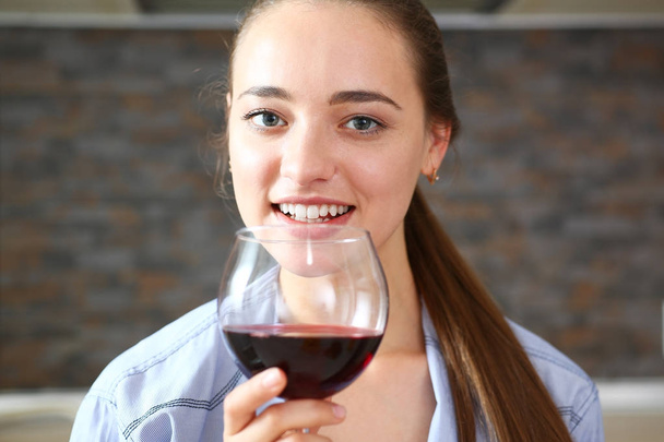 Young beautiful attractive girl drinks wine - Foto, Bild
