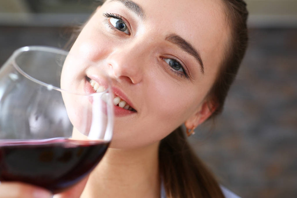 Young beautiful attractive girl drinks wine - Photo, Image