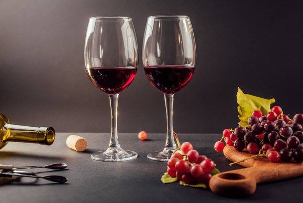 Two glasses of wine with grapes - Photo, Image