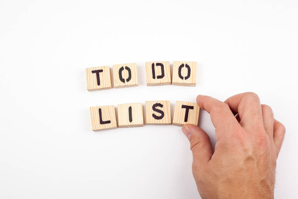 to do list. Wooden letters on a white background - Photo, Image