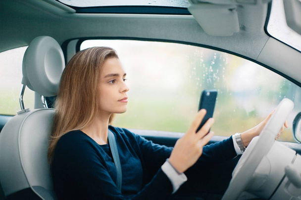 Driver with phone, dangerous driving - Fotografie, Obrázek