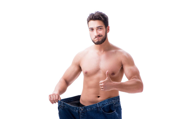Mies laihduttaminen käsite ylisuuret farkut
 - Valokuva, kuva
