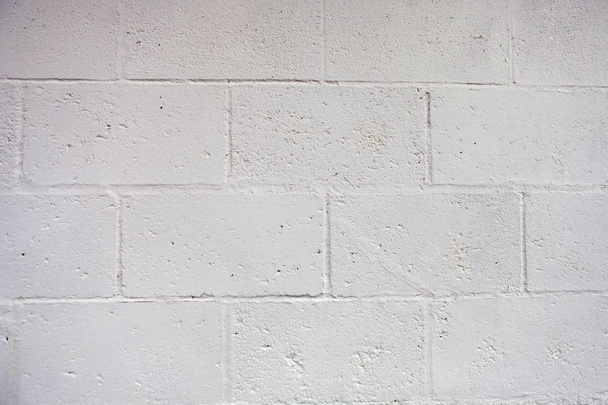 pared blanca con superficie de ladrillo de cemento
 - Foto, imagen
