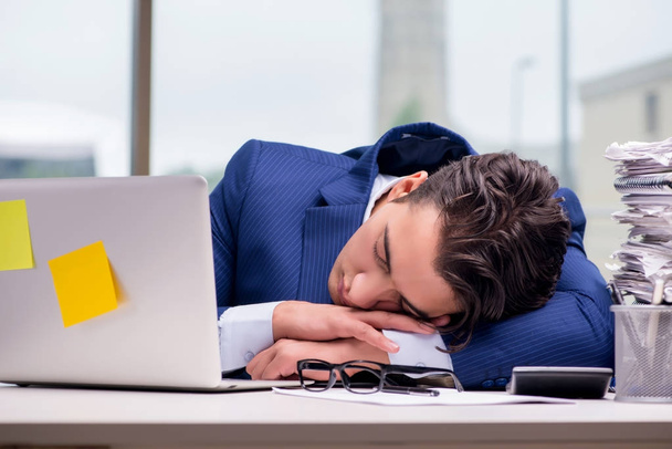 Workaholic businessman overworked with too much work in office - Photo, Image